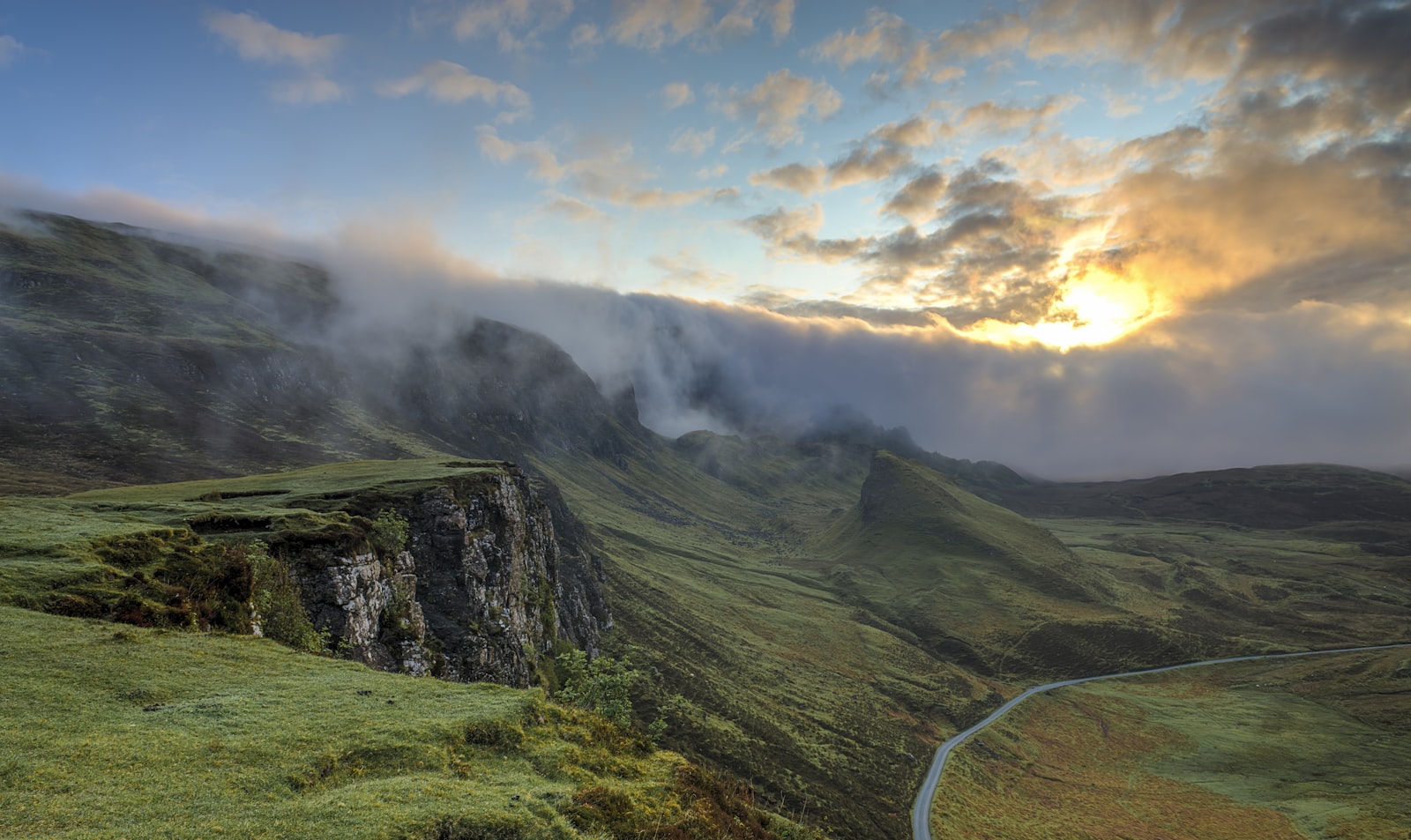 Misty layered hills and valleys at dawn